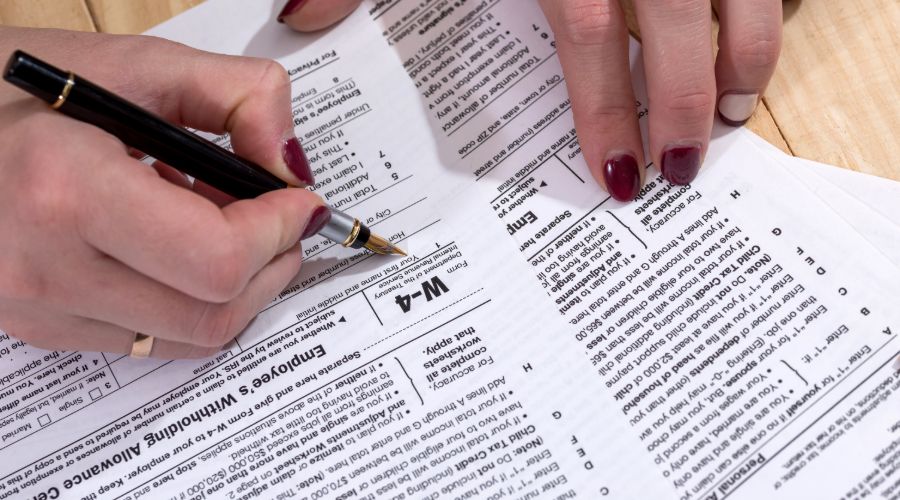 woman filling out w-4 form