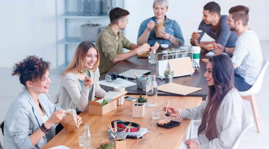 Coworkers chatting during lunch break